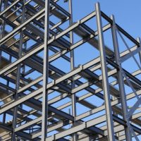 Construction steel framework against blue sky.